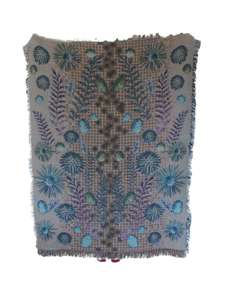 Digital Prairie, Floral, boho, with unique prairie landscapes and pollinator bees over a modern digital image of glowing squares. eco-friendly woven cotton blanket. A person holding up a blanket on the reverse view with blue, purple, green and cream with black glowing squares down the middle