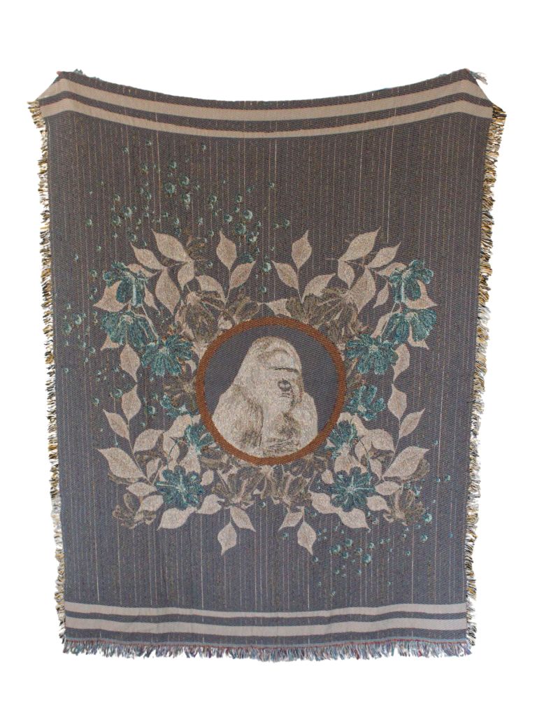 Majesty, the endangered Mountain Gorilla of central Africa. Natural pin stripe and floral portrait with sherbet orange flowers and pearls; eco-friendly woven throw blanket. Blanket held up with reverse colors of grey, blue, cream and a rust circular frame.
