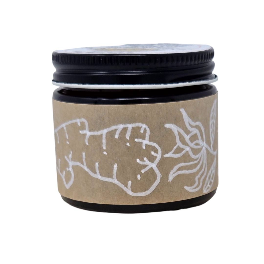 Hand-made herbal medicinal balm with a hand-drawl label of ginger and ylang-ylang essential oils in an amber glass jar. 2oz jar