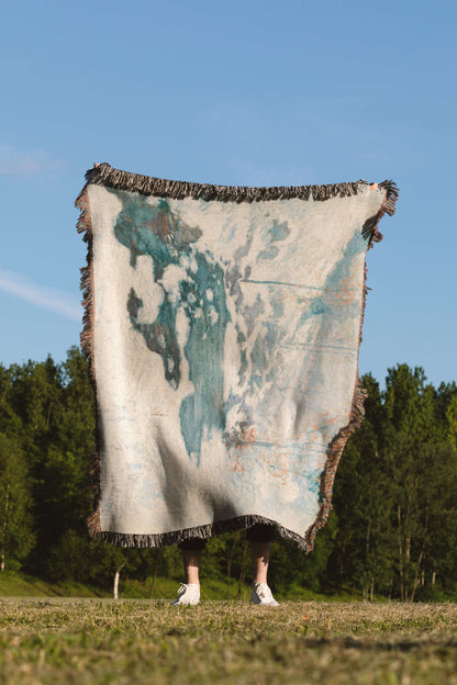 Sonorous Love, Icebound by John Henry Twachtman, featuring a serene abstract artwork winter scene with curves of ice and snow; white, blue and orange leaves. eco-friendly cotton woven blanket