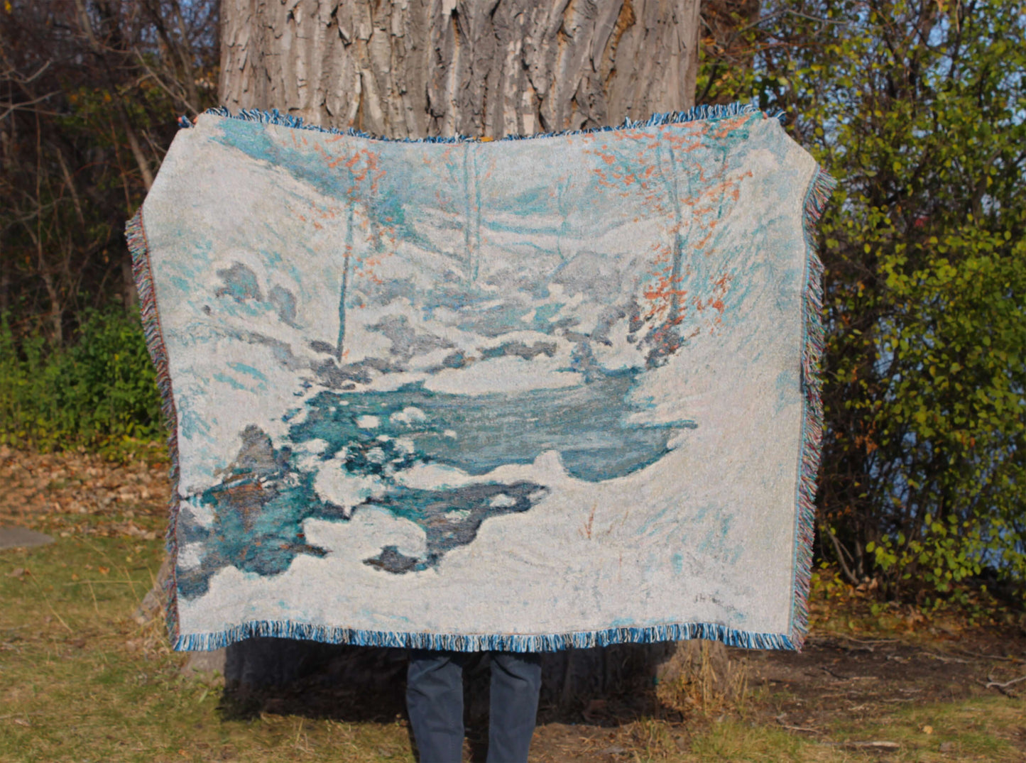 Sonorous Love, Icebound by John Henry Twachtman, featuring a serene abstract artwork winter scene with curves of ice and snow; white, blue and orange leaves. eco-friendly cotton woven blanket