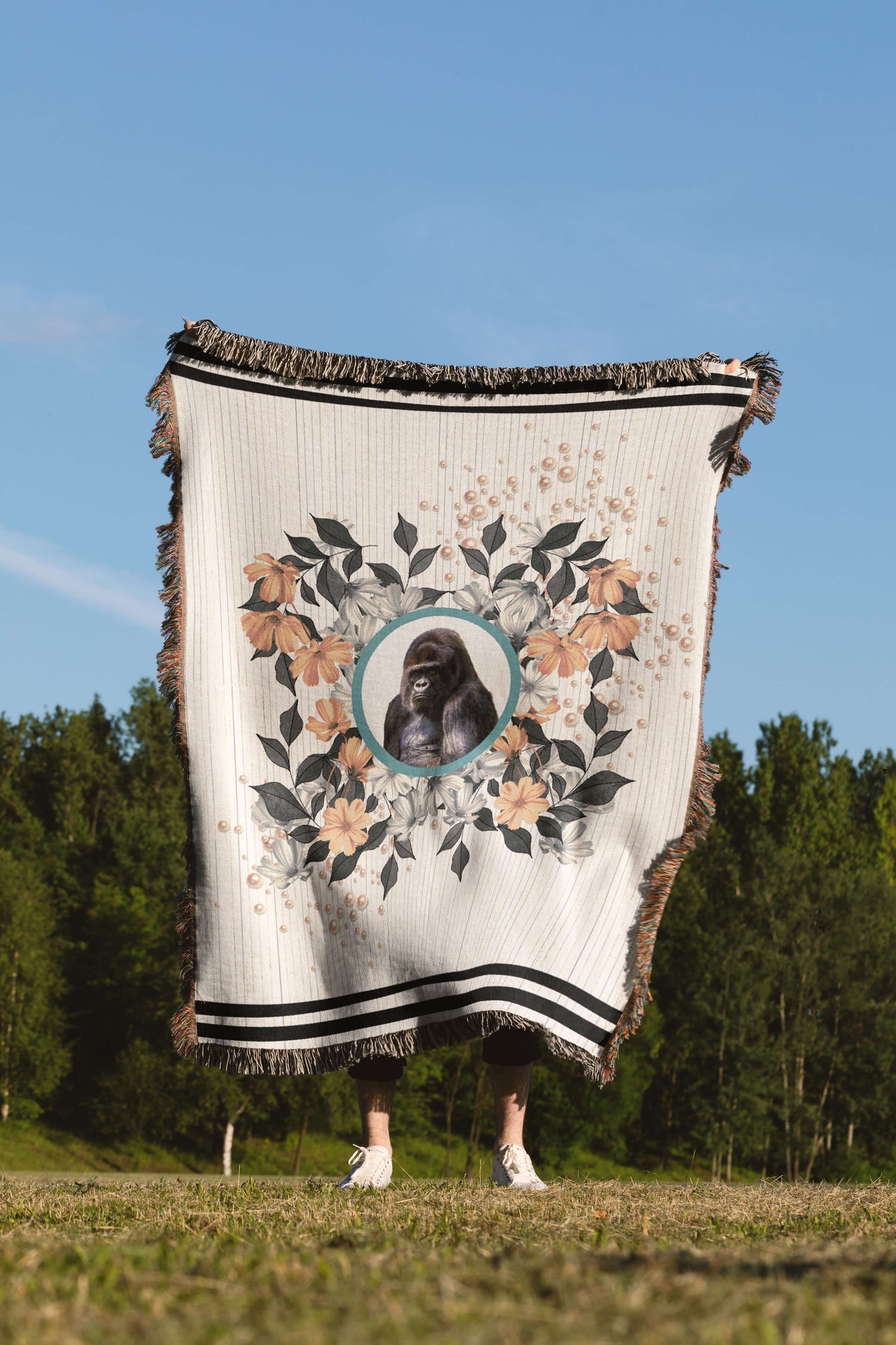 Sonorous Love, Majesty, inspired by the beauty of the endangered Mountain Gorilla, gentle giants of central Africa. Natural, stripe and floral portrait with sherbet orange pearls; eco-friendly woven throw blanket