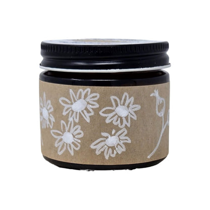 Amber Jar with a black lid and brown label featuring hand-drawn, white floral designs on a white background. 2oz size