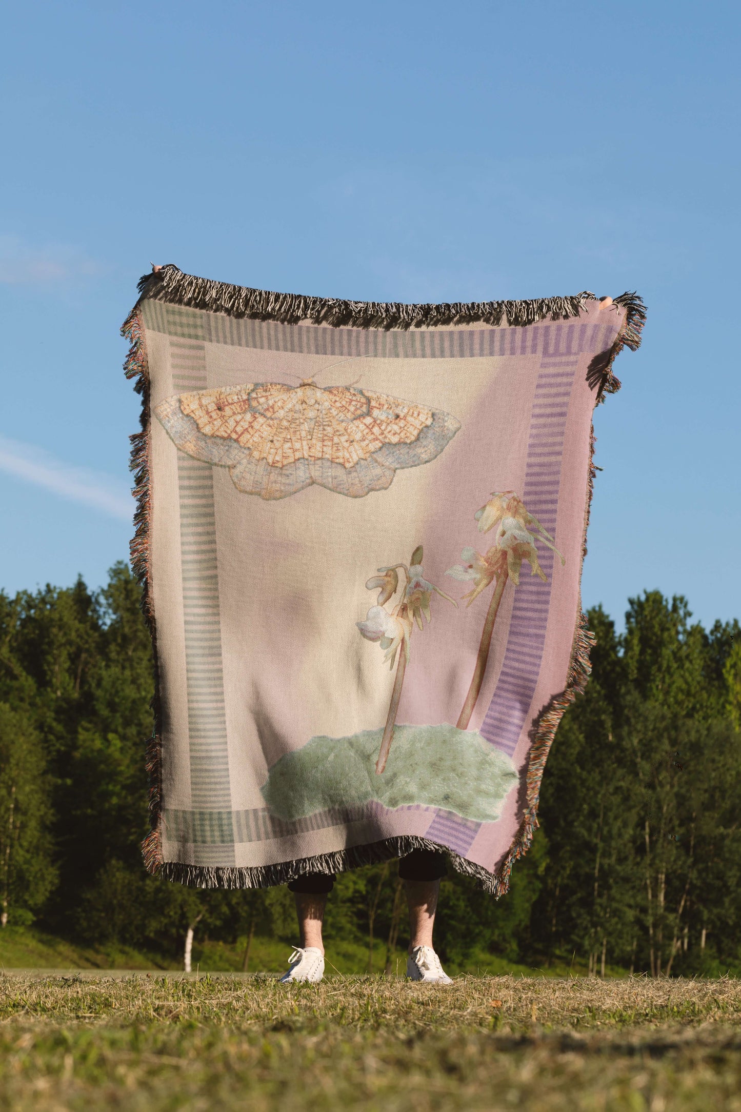 Sonorous Love, Sunset Moth + Orchid, designed to honor two rare species: the Dark Bordered Beauty and the Ghost Orchid; mauve purple and pink with green moss collage with yellow moth. eco-friendly cotton woven throw blanket