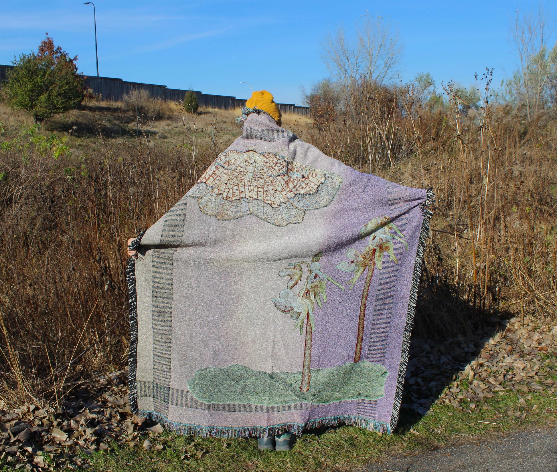 Sonorous Love, Sunset Moth + Orchid, designed to honor two rare species: the Dark Bordered Beauty and the Ghost Orchid; mauve purple and pink with green moss collage with yellow moth. eco-friendly cotton woven throw blanket