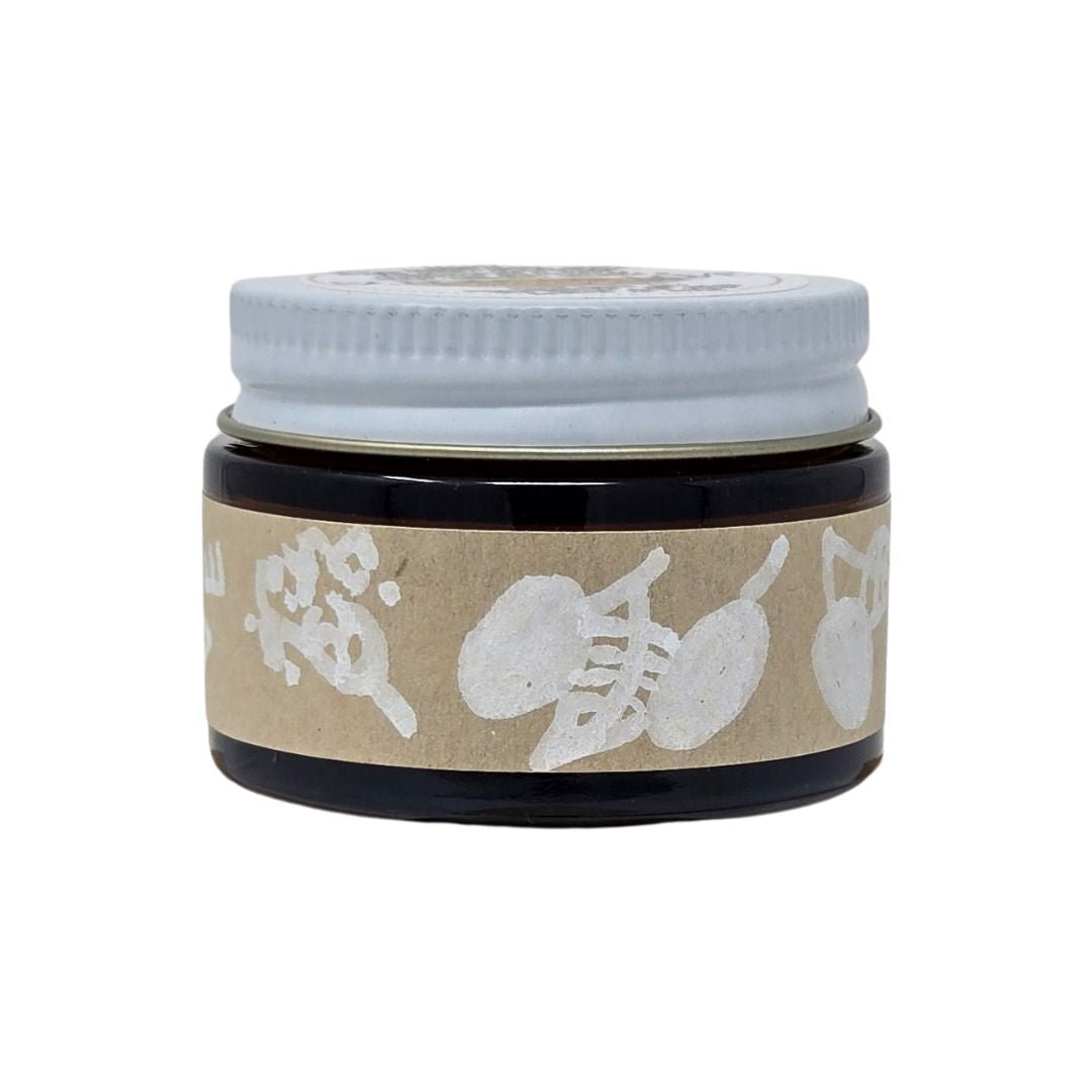 Jar with a white lid and decorative label on a white background